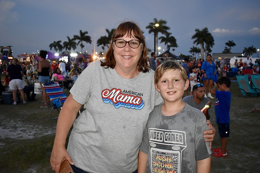 Palmetto resident Renee Lenneman enjoys the show with her foster son Jadon Posey.