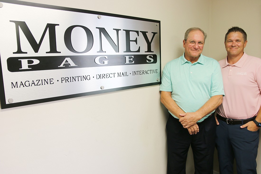 Don and Walker Grindle are celebrating 10 years of business with Money Pages Volusia. Photo by Jarleene Almenas