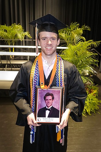 As Hawk of the Year, Matthew Monroe's photo will join previous award winners on his school's wall of fame. Courtesy photo