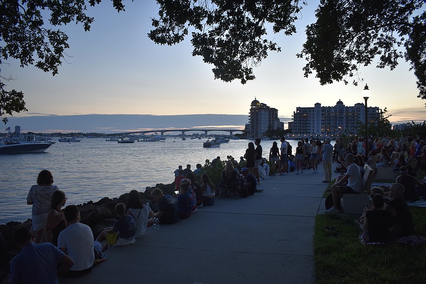 Attendees gather along the bayfront.