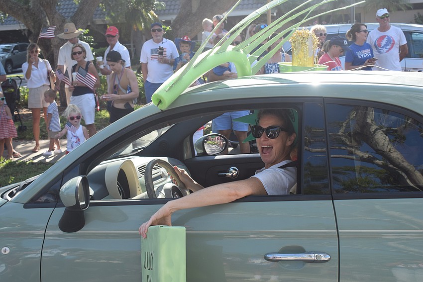 Suzy Brenner driving the Paradise Center car in the parade.