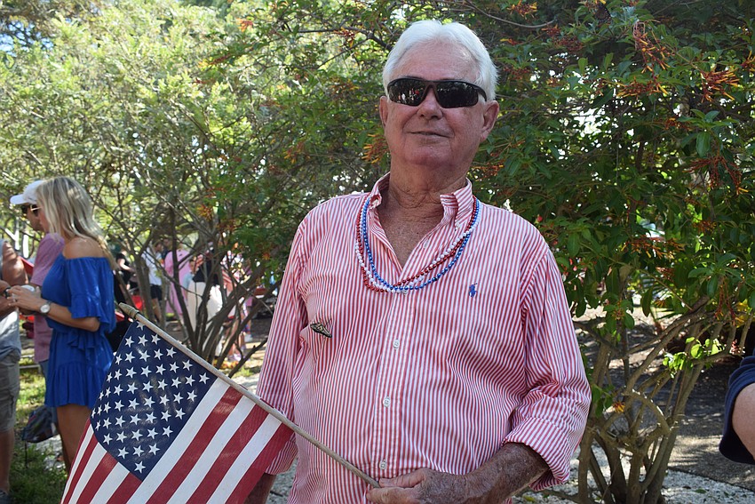 Jim Brown, former mayor, enjoys the Freedom Fest with a butterfly flying on his shirt.
