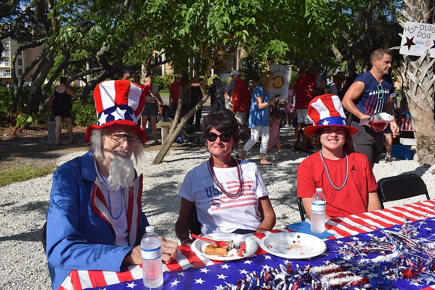 Jim Seaton, who plays Uncle Sam every year at Freedom Fest, eats with his family.
