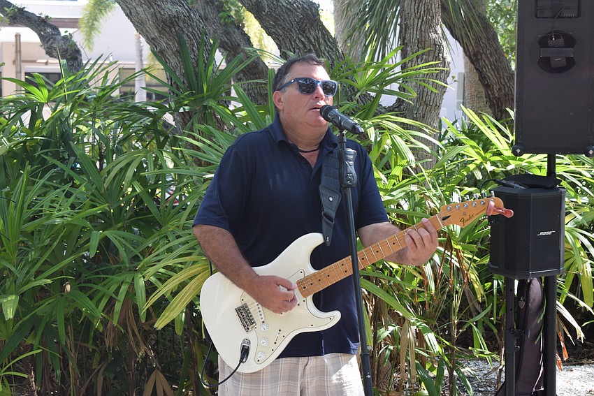 Mike Sales providing live music at Freedom Fest in Bicentennial Park.