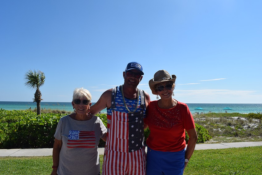 June Hessel, Michael Darter, and Sandy Endres enjoying the beautiful view of the Gulf in the Seaplace clubhouse patio.