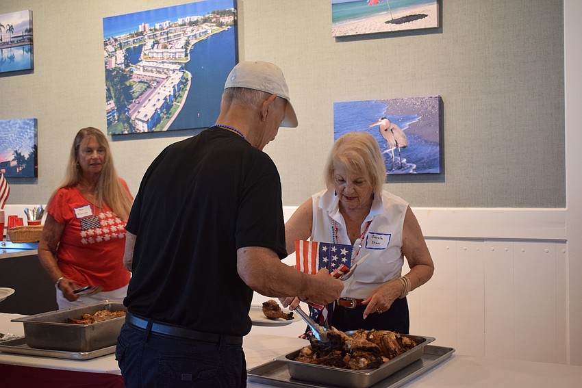 Residents and visitors of Longboat Harbour chose from an assortment of classic American food at their Fourth of July party.