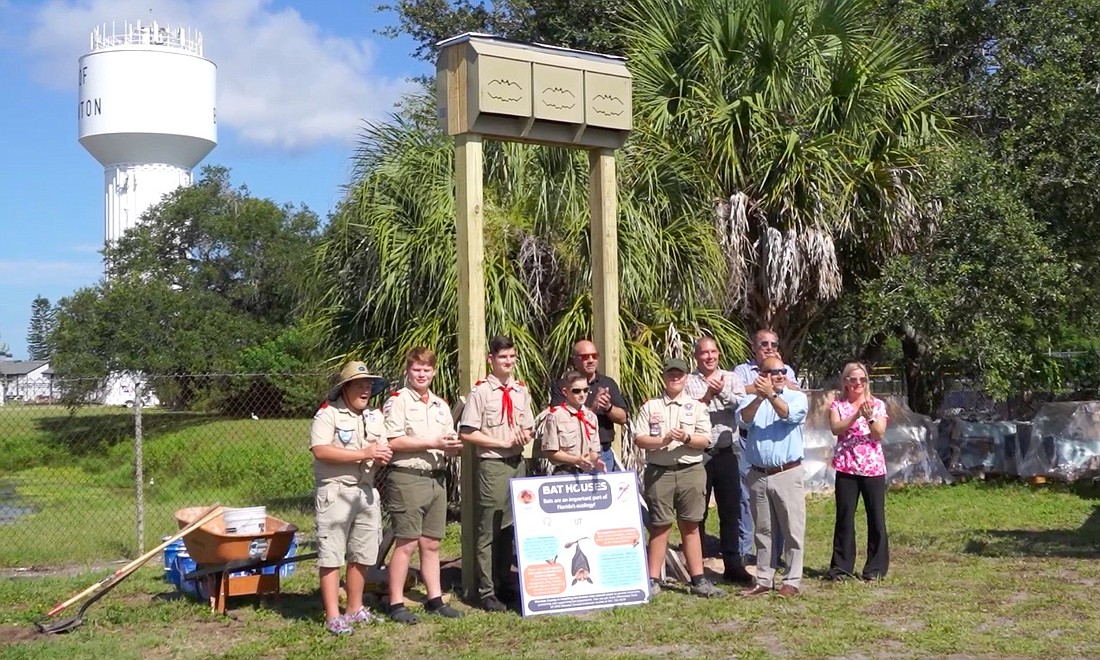 Boy Scouts from Parrish and Lakewood Ranch, along with Manatee County staff, unveil the bat house they helped build and install at G.T. Bray Park.