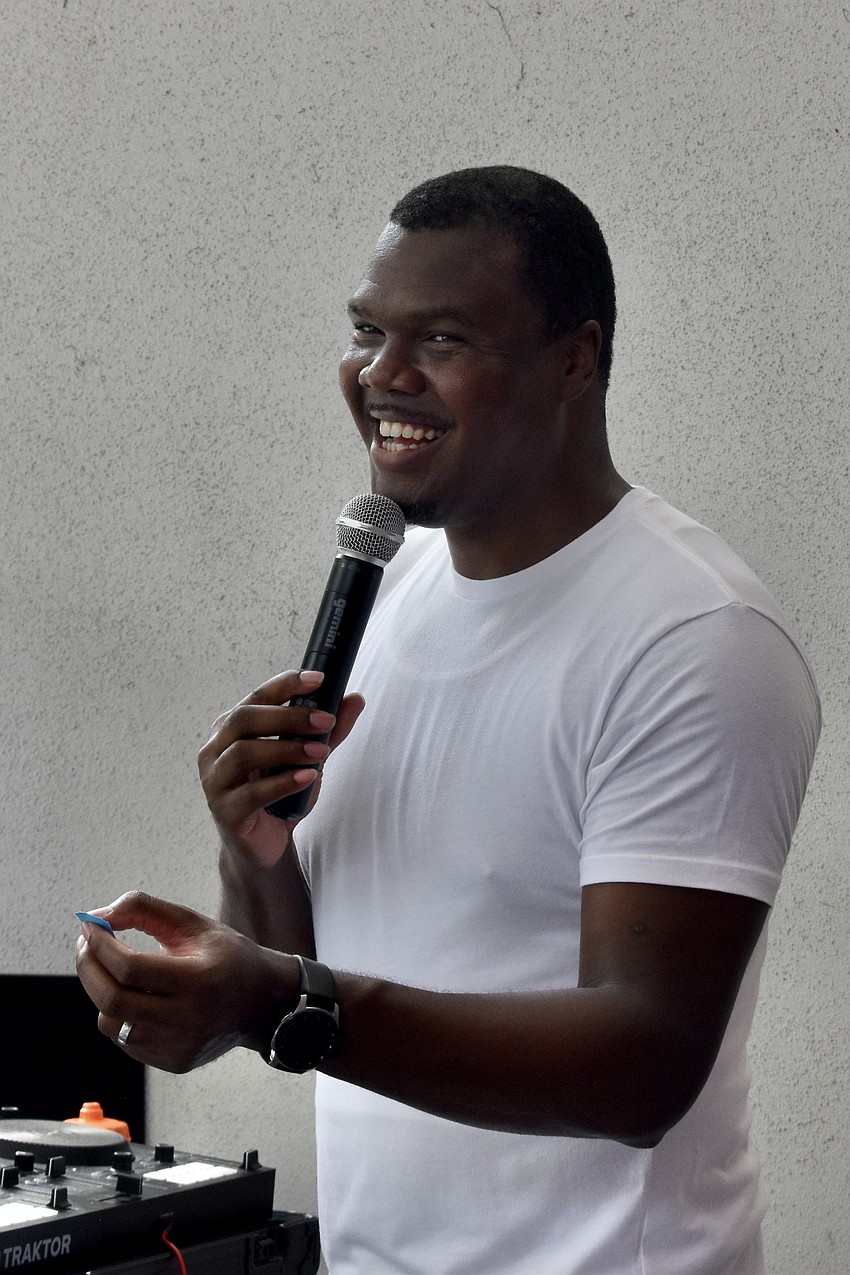 DJ Nate Brown calls on the winner of a raffle prize.