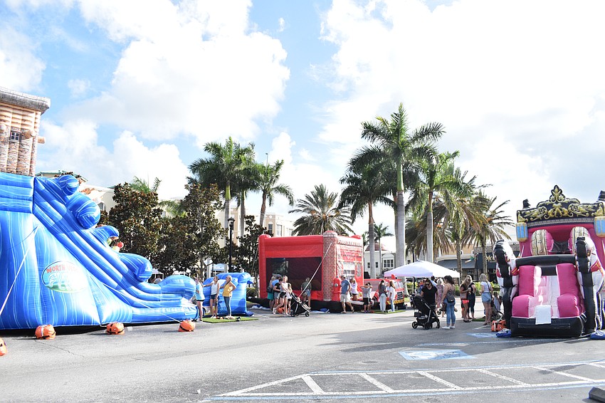 Children make their way through the different inflatables available in the kids zone.