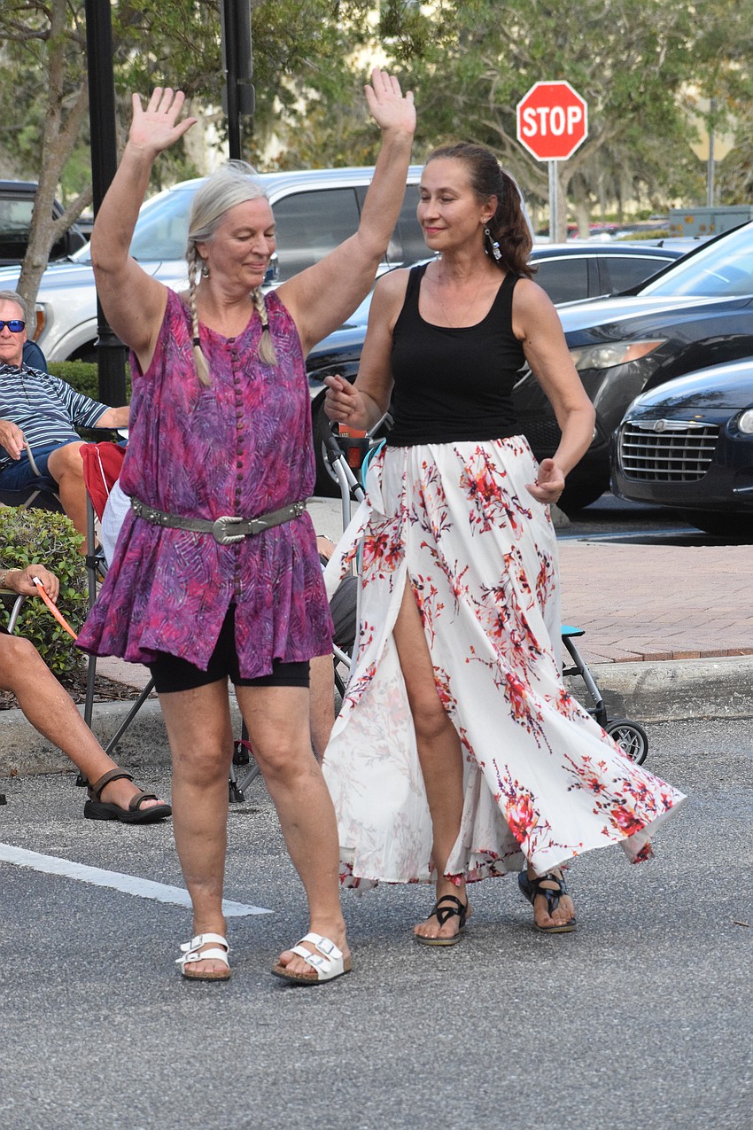 Sarasota's Mica Glasberg and Elena Lidgard dance to Latin, R&B and island dance music.
