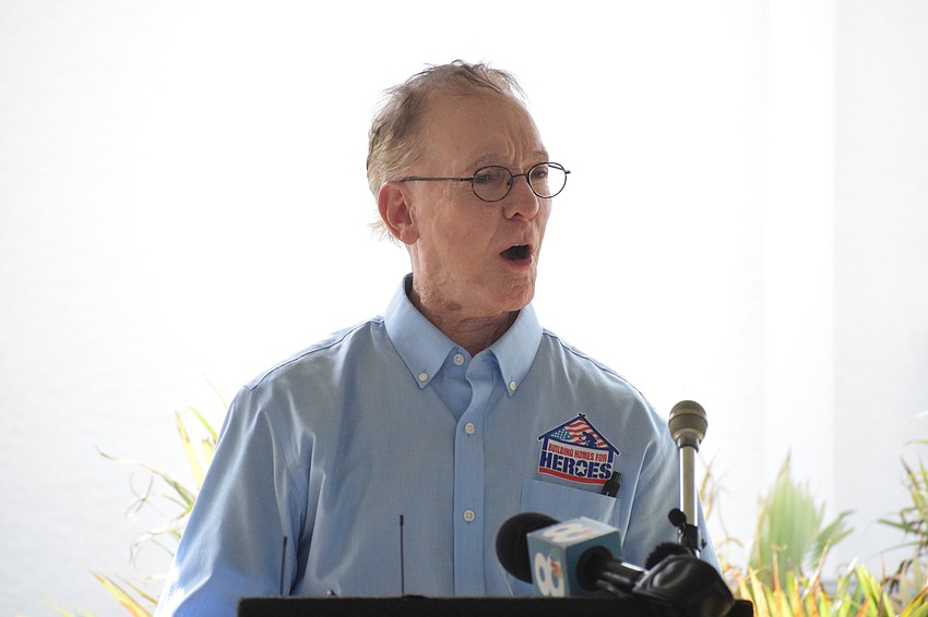 Andy Prujol, the founder of Building Homes for Heroes, asks the Gaytan family if they are excited to enter their new home.