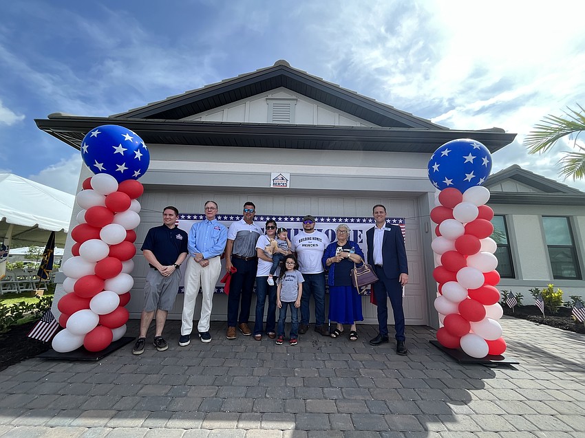 Representatives from PulteGroup’s Built to Honor program and Building Homes for Heroes welcomes the Gaytan family to their new home in Sapphire Point of Lakewood Ranch.