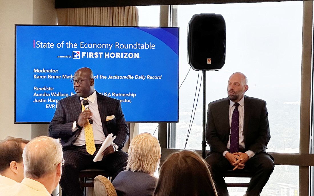 Left, Aundra Wallace, president of JAXUSA Partnership, and Justin Harp, First Horizon Bank managing director and executive vice president of the Derivative Products Group, take part in a First Horizon Bank breakfast roundtable June 29 at The River Club in Downtown Jacksonville.