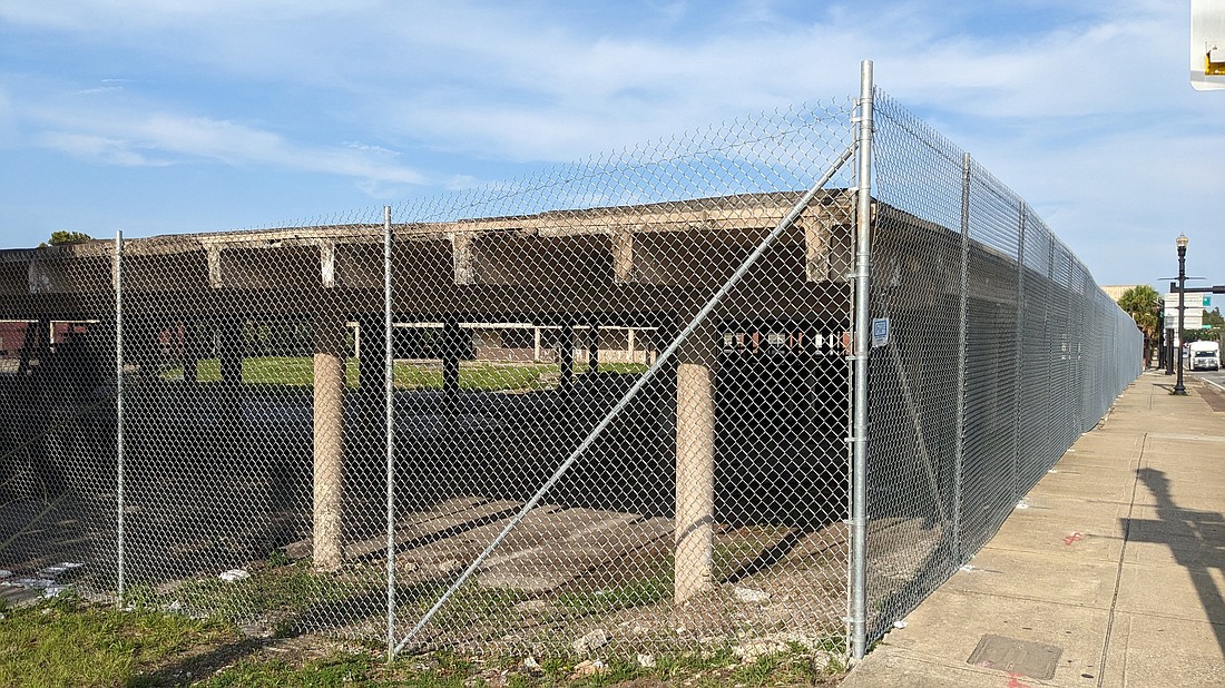 A fence now surrounds at the remains of the 901 N. Main St. parking deck. It's the former site of the Park View Inn in Springfield near Downtown.