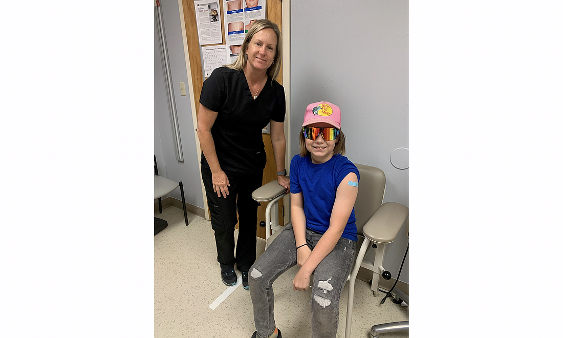 Florida Department of Health Flagler RN Mindy Fitts, left, with Myles Wilson, 12. Photo Courtesy of the Florida Department of Health in Flagler County