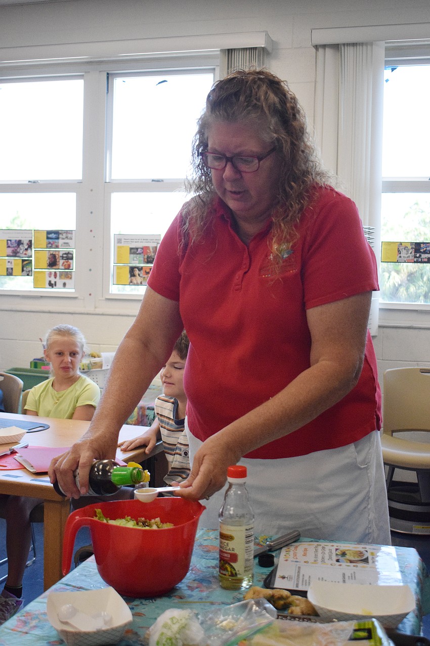 Kristi Mezick, the owner of Pure Imagination Studio, leads the Crazy Cooks Camp.