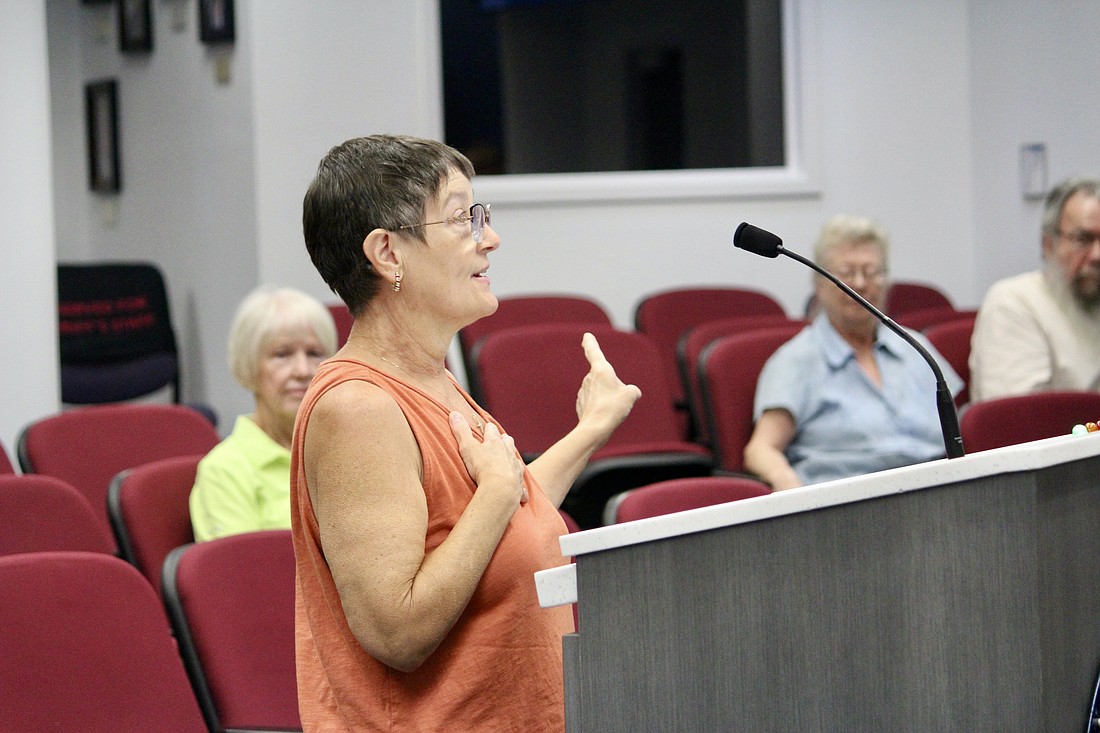 Lisa Pring, the president of the Braden Woods Homeowners Association, Phases 1-4, thanks Elise Evans for bringing photographs that show there was no sign posted at the site for a proposed residential development on Linger Lodge Road.