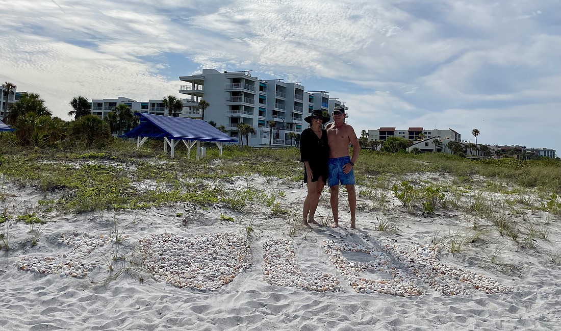 Michele De Luce and Leighton Allenby made a beach mural on Bay Isles Beach expressing their love for Longboat Key.