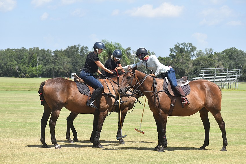 Karen Medford, Jackie Tamminga and instructor Ashlie Osburg work through a lesson at the Sarasota Polo Club.