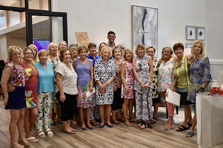 Gardeners Out East members pose with John Gidding before the former TV host's presentation. The club only booked Gidding a month ago when Carolyn Lowry-Nation heard he was speaking at The Villages.