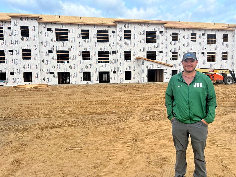 Andy Allen, Corner Lot CEO, stands in front of what will be the Lofts of Novotny apartments in Baxter, Minnesota. It is Corner Lot’s first project outside of Florida.