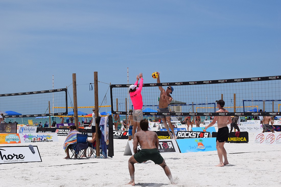 A Men's Open division team in the July Independence Volleyball Tournament  on Lido Key Beach.