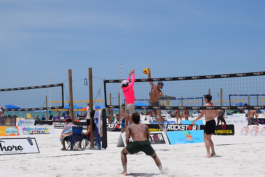 A Men's Open division team in the July Independence Volleyball Tournament  on Lido Key Beach.