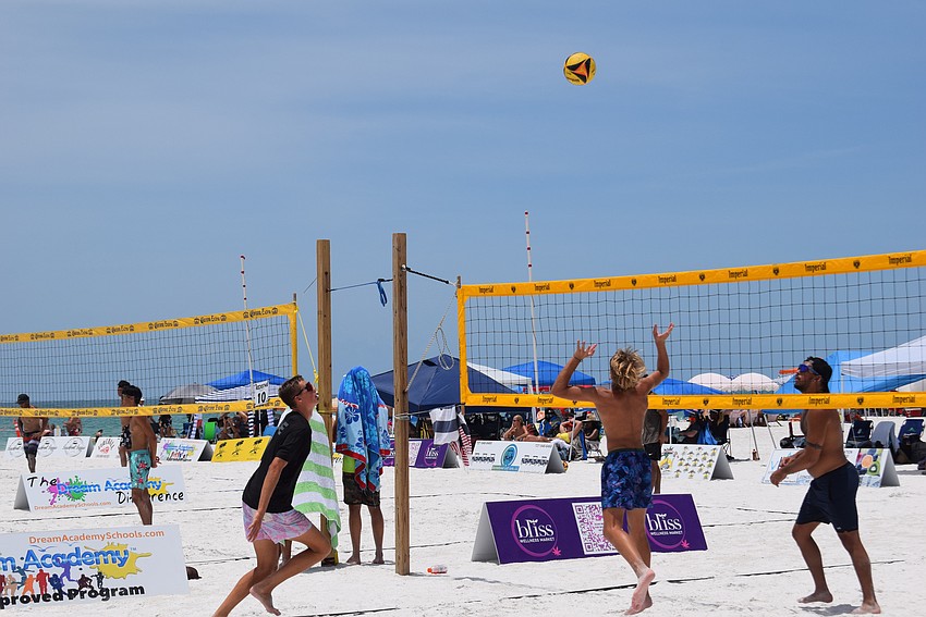 Men's Open division teams plays in the July Independence Volleyball Tournament on Lido Key Beach.