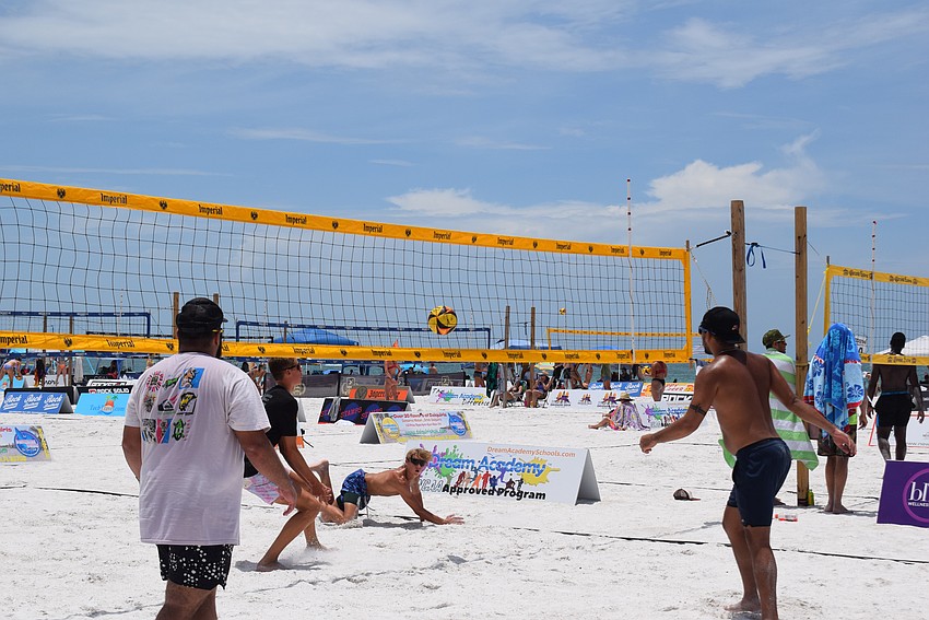 Men's Open division teams plays in the July Independence Volleyball Tournament on Lido Key Beach.