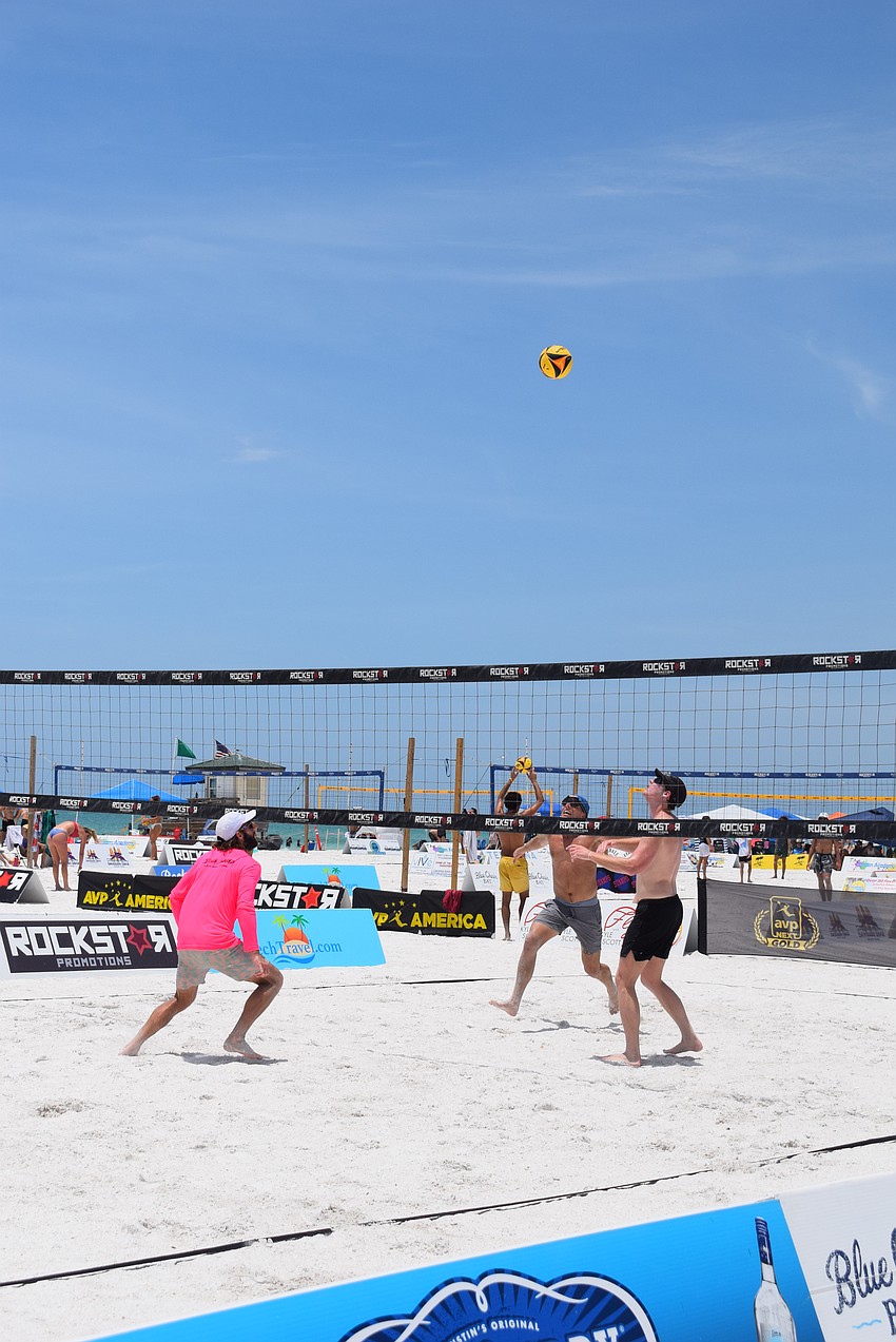 Men's Open division teams plays in the July Independence Volleyball Tournament on Lido Key Beach.