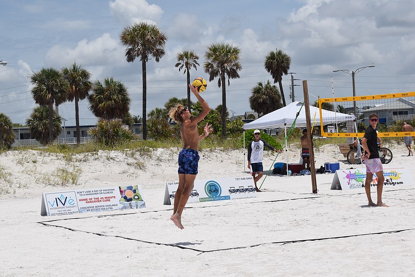 A player spiking at the July Independence Volleyball Tournament on Lido Key Beach.