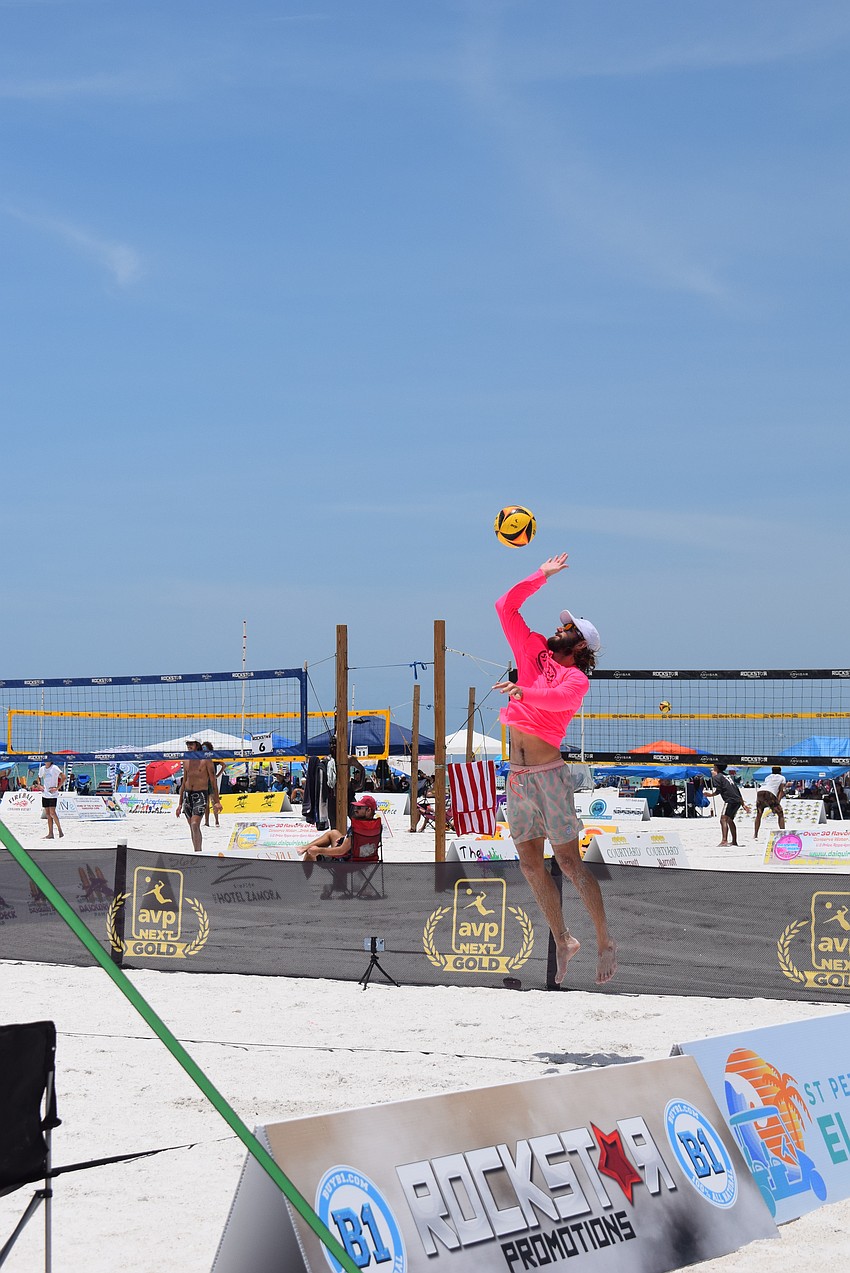 A player spiking at the July Independence Volleyball Tournament on Lido Key Beach.