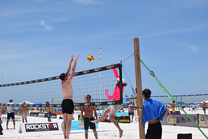 A Men's Open division team in the July Independence Volleyball Tournament on Lido Key Beach.
