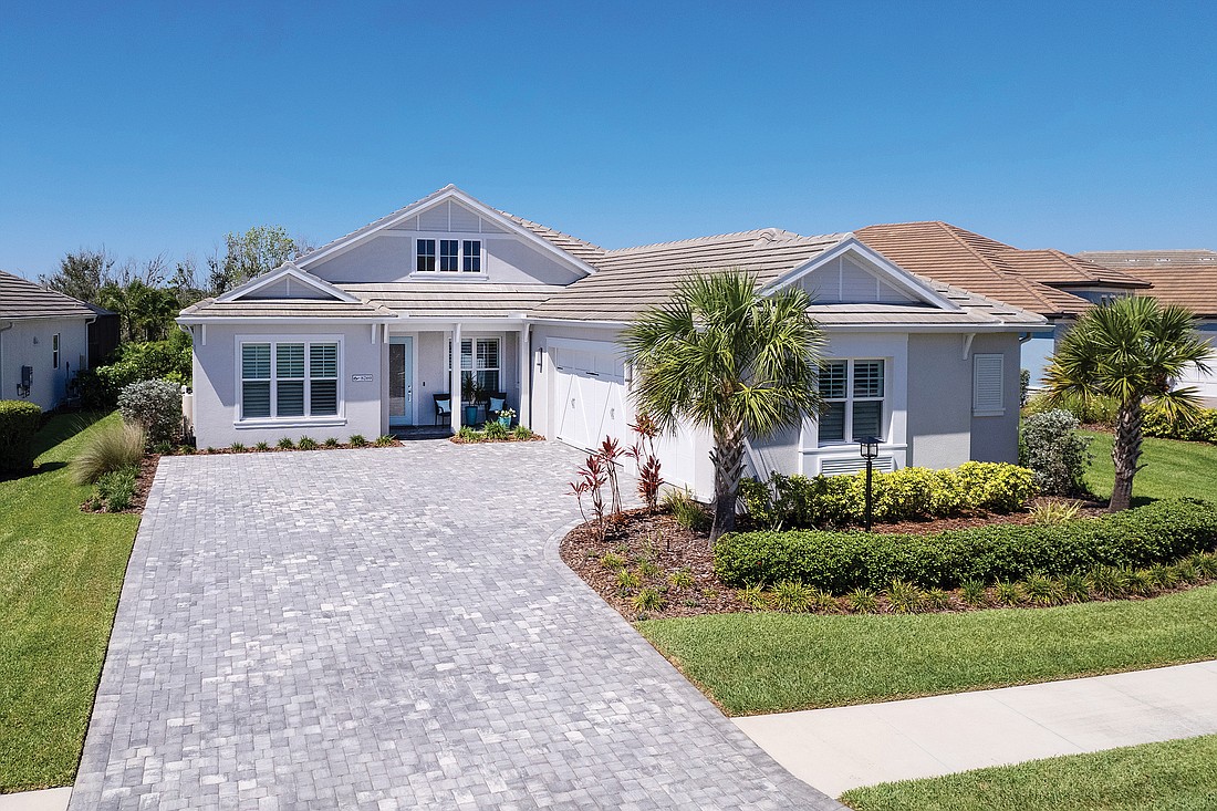 This Lakehouse Cove at Waterside home at 8269 Grande Shores Drive for $1.5 million. It has three bedrooms, three baths, a pool and 2,718 square feet of living area.