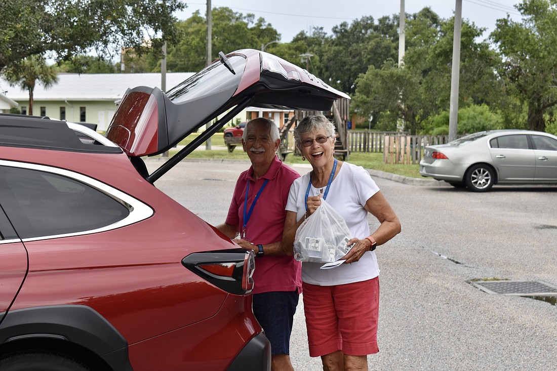 Ronald and Marcia Owens say they do most things together, but they especially have fun delivering meals together.