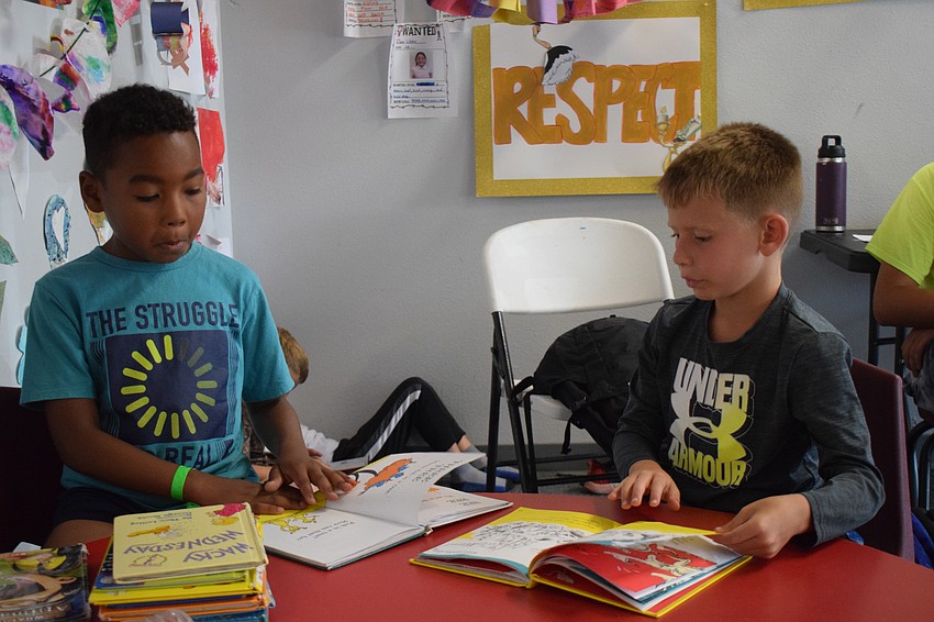 Miles Garvin, who is 7, and Luca Montovani, who is 8, collect as many Dr. Seuss books as they can. Their favorite is 