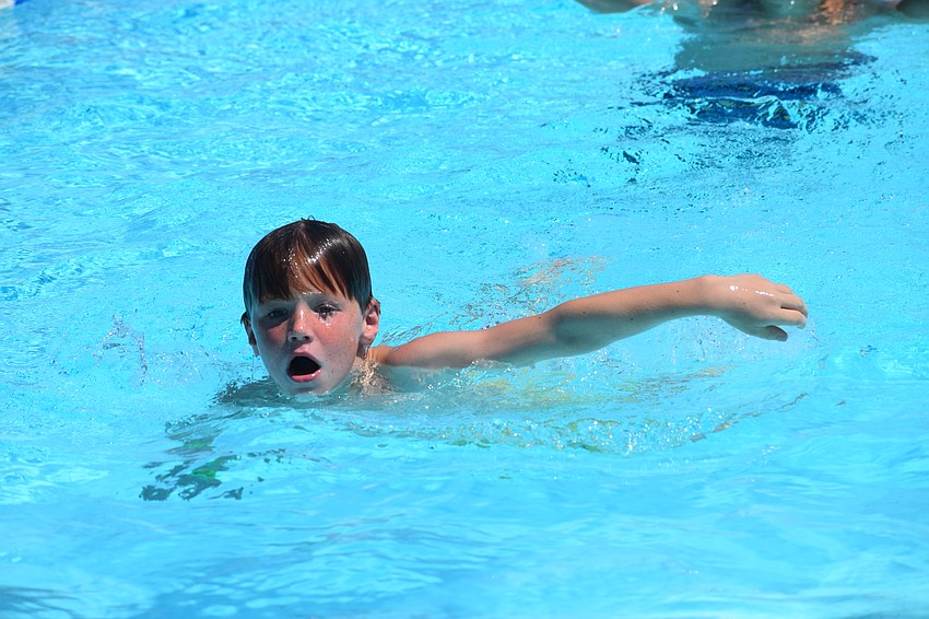 Parker Christman practices swimming freestyle.