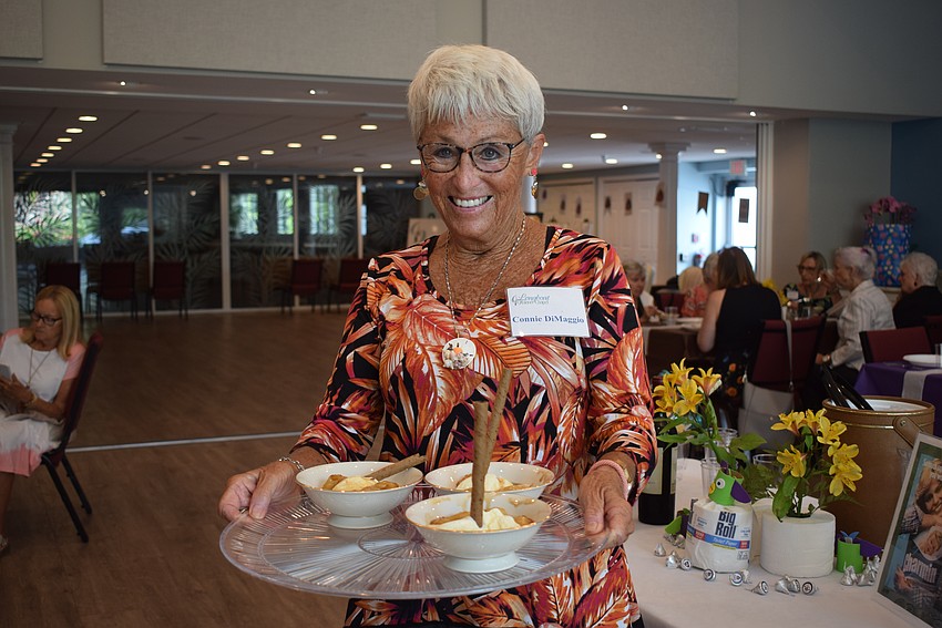 Connie DiMaggio serving bananas foster.