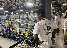 John Mcclain tours PGT Innovations, a custom windows and doors manufacturer. Students are learning about the manufacturing process, safety protocols and available jobs through The Haven's vocational summer camp.