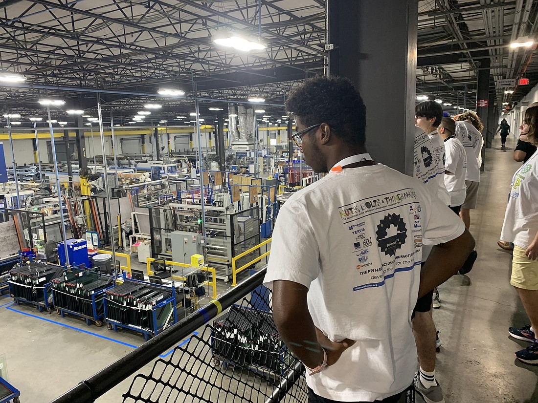 John Mcclain tours PGT Innovations, a custom windows and doors manufacturer. Students are learning about the manufacturing process, safety protocols and available jobs through The Haven's vocational summer camp.