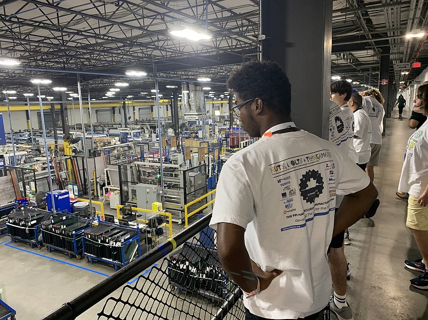John Mcclain tours PGT Innovations, a custom windows and doors manufacturer. Students are learning about the manufacturing process, safety protocols and available jobs through The Haven's vocational summer camp.