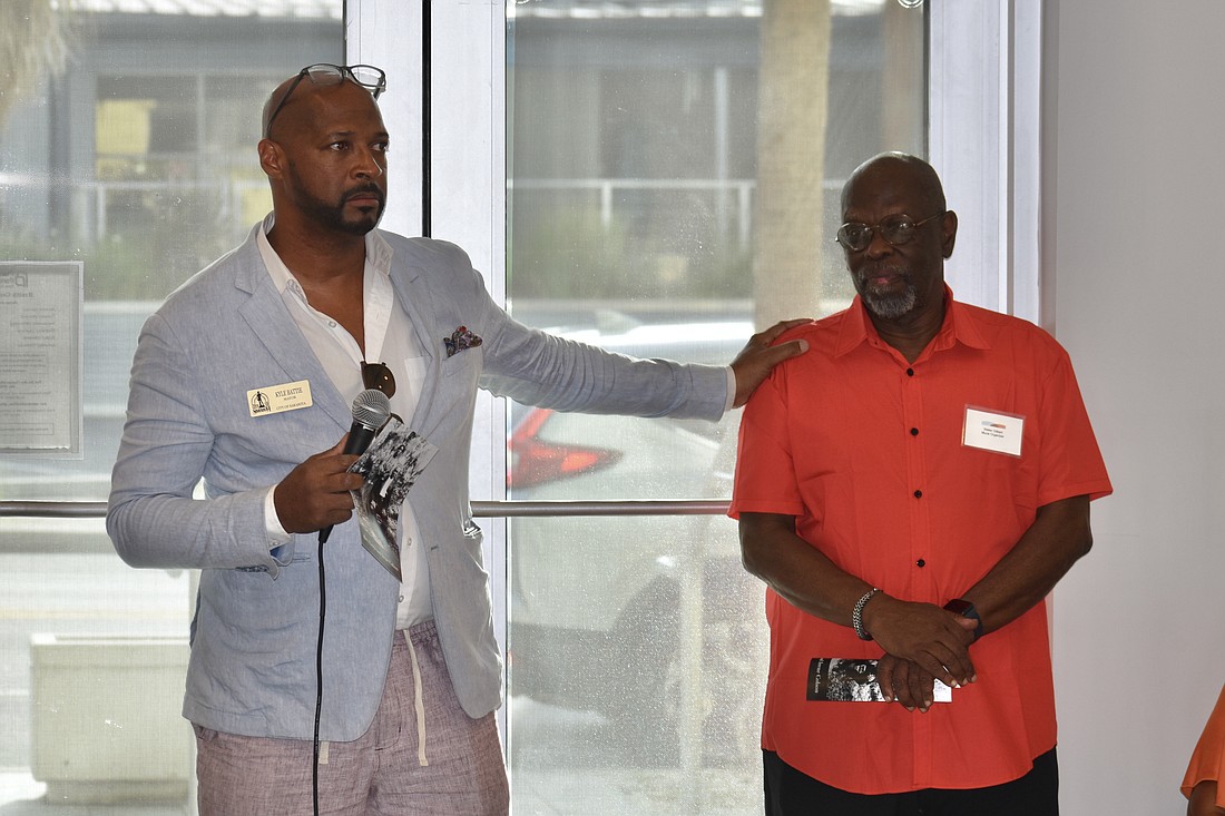 Mayor Kyle Battie speaks alongside Mural Organizer Walter Gilbert.