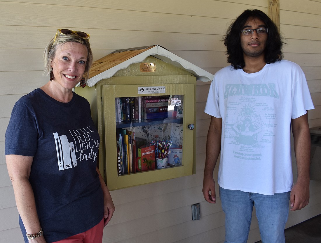 Lakewood Ranch Little Free Library founder Elizabeth Henderson and Neel Menon dedicate the new library in Bob Gardner Park to Jai Menon, Neel's brother who died in 2016.