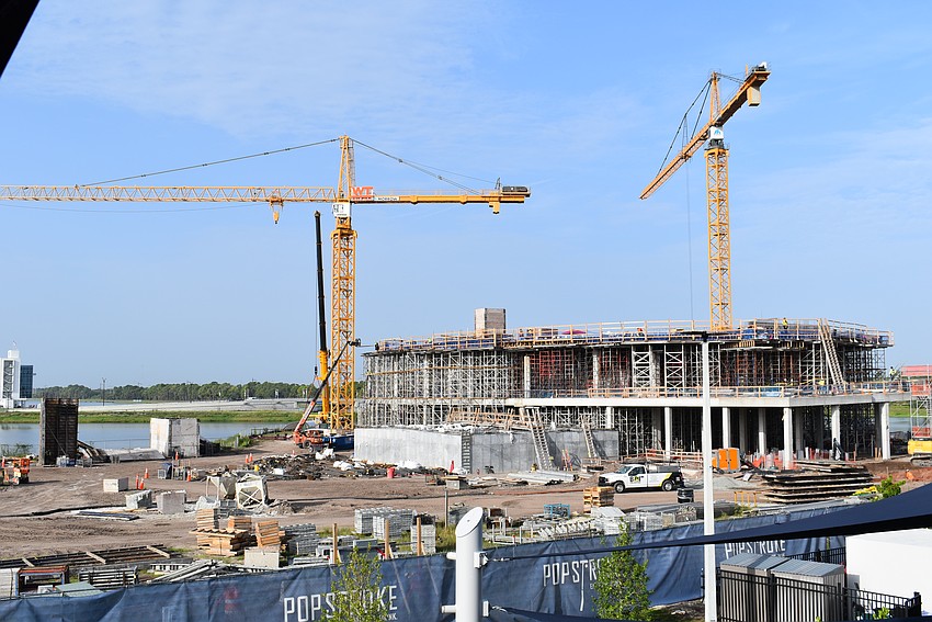 The tower cranes already at the site are rated at about 15,000 pounds capability so a crane rated to 300 tons was brought to the site to place the two acrylic windows for the Gulf of Mexico Gallery that weigh about 15 tons each.