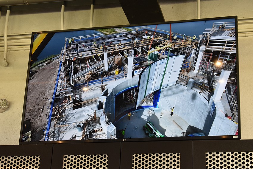 After the acrylic window was lowered down into the aquarium, those watching from PopStroke saw the rest of the task completed on big screens with video provided by a drone.