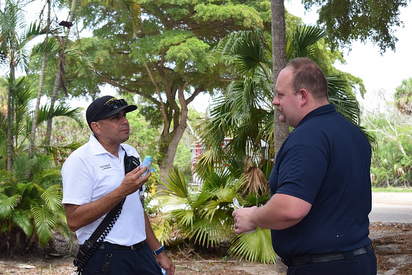 Fire and Police department of Longboat Key mingle over ice cream provided by the Longboat Key Rotary Club on July 25.