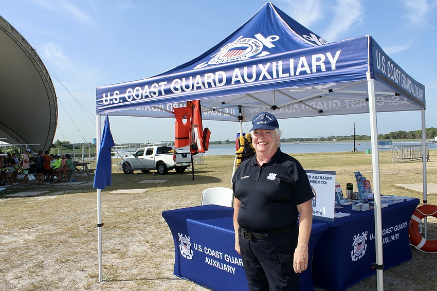 Flotilla 86 Vice Commander Carol Hoernle mans the auxiliary's information tent.