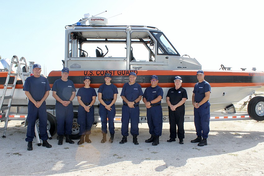 Members of the U.S. Coast Guard and the auxiliary bring a boat and helicopter to entertain campers at Nathan Benderson Park. From left to right: Chris Juall, Walter Finkelstein, Brittany Rosciolo, Alaina Stonestreet, Murray Price, Bill Krulac, Carol Hoernle and Jonathan Laronge.