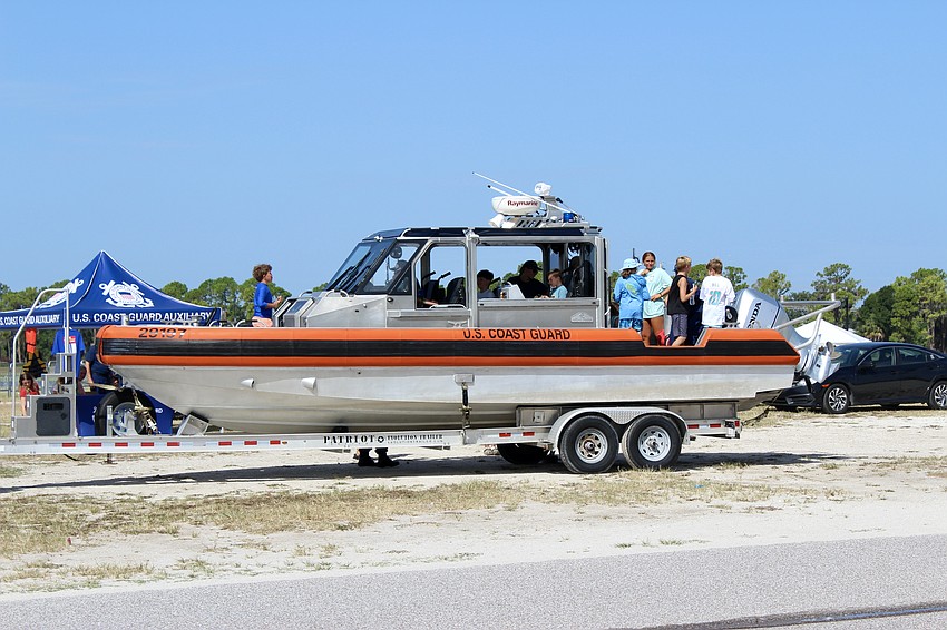 Campers tour a 29-foot response boat used by the U.S. Coast Guard.