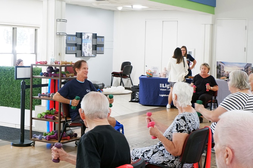 Mike McManus leads an aerobics class on July 28 during the Senior Friendship Centers Wellness in Motion Senior Health & Services Fair.